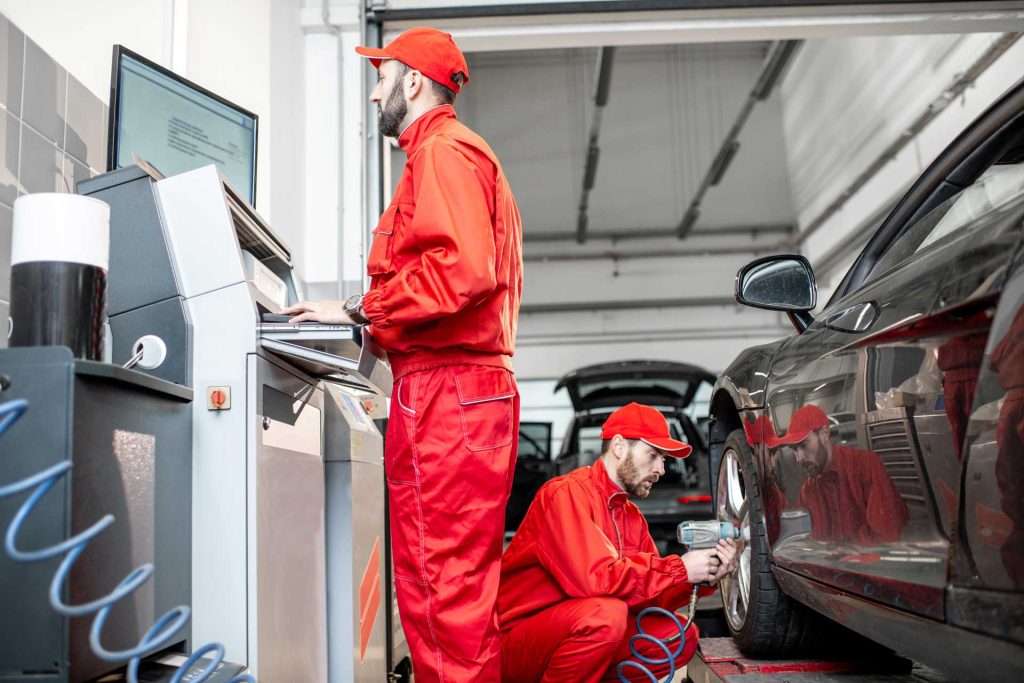 Home-Based Tyre Services in Bristol: Tyre Care at Your Doorstep with Fast Grip 1 car service workers changing wheels